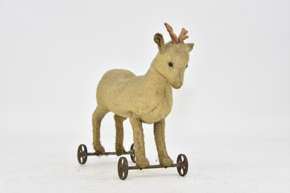 Vintage Mohair Steiff Deer: Vintage mohair steiff deer on metal wheels with original ear button, circa 1908 12"h x 12"l x 5.25"w
