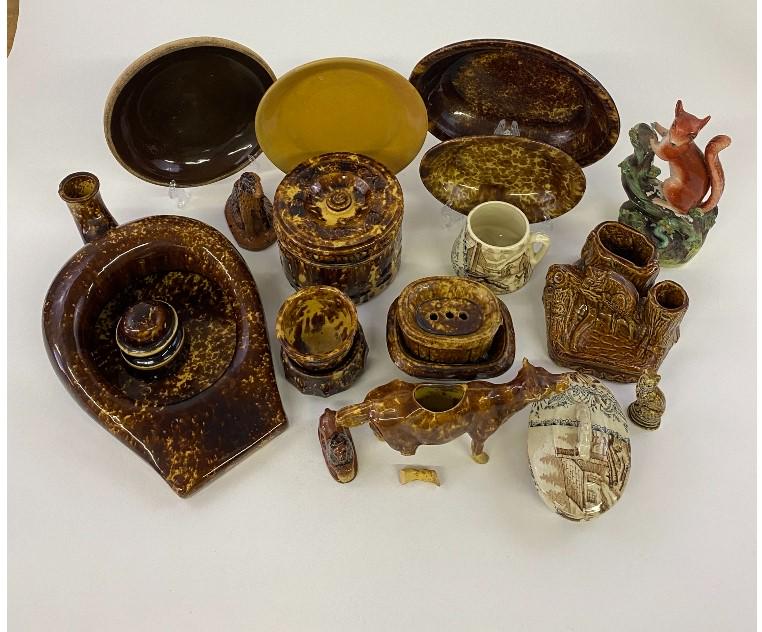Rockingham Tableware etc.: Rockingham tableware to include a cat desk piece 4"h x 7"w; oval dishes, soap trays, a cow creamer; together with a Staffordshire squirrel