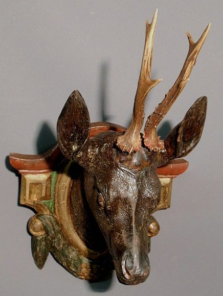 Black Forest carved roe deer head mounted on a po