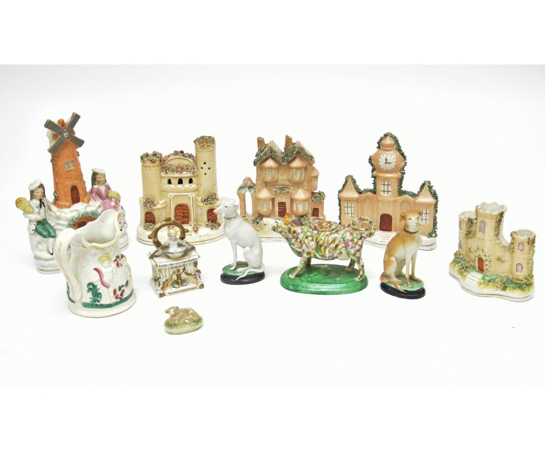 Eleven Pieces of Tableware: Eleven pieces of tableware to include Staffordshire, Castle cottage form/buildings, the Royal Children and cow creamer etc. Tallest = 9"h x 6.5"w