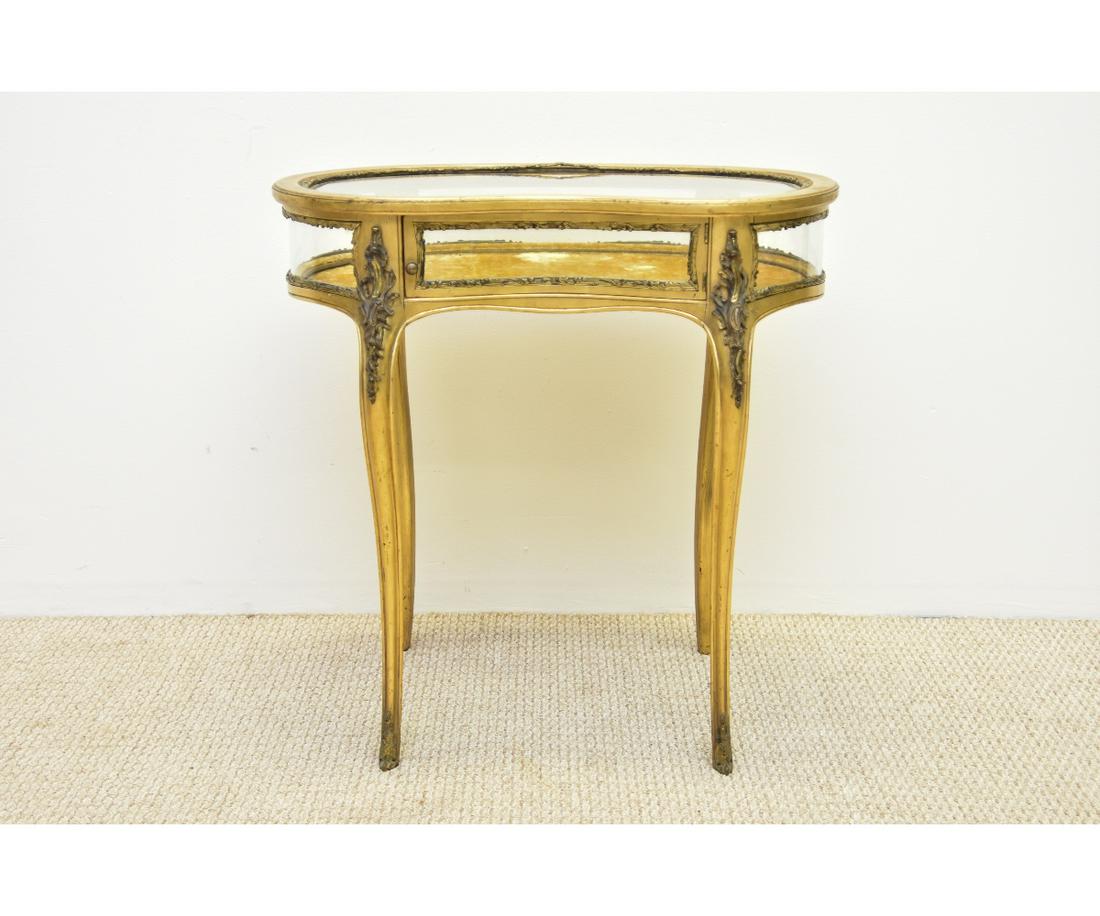 Kidney-Shaped Gilt Vitreen: Kidney-shaped gilt French vitreen, circa 1920 with beveled glass and metal ormolu mounts 30"h x 29.5"w x 16"d