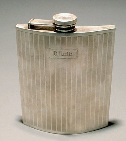 Sterling silver ½ pint flask with "B. Ruth" engrav: Sterling silver ½ pint flask with "B. Ruth" engraved and with red enameled crossed baseball bats, by International Silver Co. 6.5"h.x4.5"w.