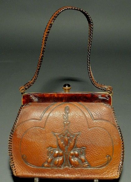 Meeker Arts & Crafts tooled leather purse signed “: Meeker Arts & Crafts tooled leather purse signed “Meeker Made”. 6.5”h.x7.5”w.
