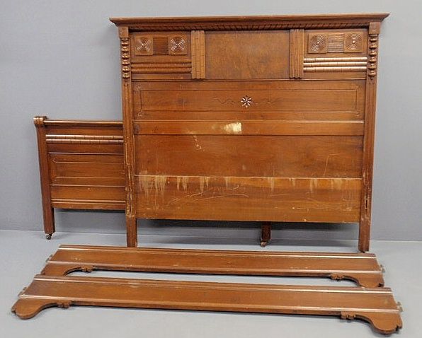 Eastlake walnut bed with carved headboard 55”h.x60: Eastlake walnut bed with carved headboard 55”h.x60.5”w., foot board 32”h., rails 74”l.