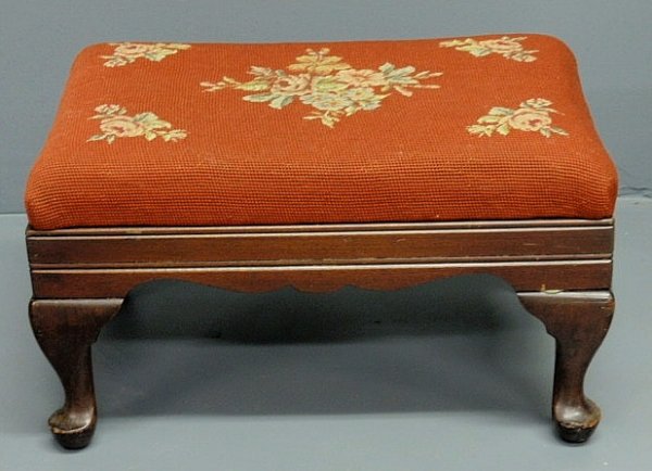 Queen Anne style footstool with floral needlepoint: Queen Anne style footstool with floral needlepoint top. 10"h.x12.5"x18"
