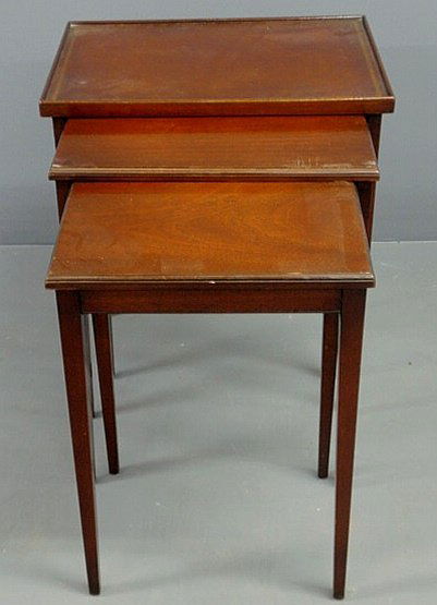 Hepplewhite style nesting tables, set of three, la: Hepplewhite style nesting tables, set of three, largest with a tooled leather top, 24.5"h., top 21"x15