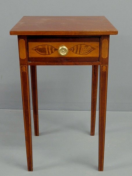 Hepplewhite mahogany stand, early 19th c., the dra: Hepplewhite mahogany stand, early 19th c., the drawer inlaid with conch shells, the legs with ferns and bellflowers. 26"h., top 16"x16.25