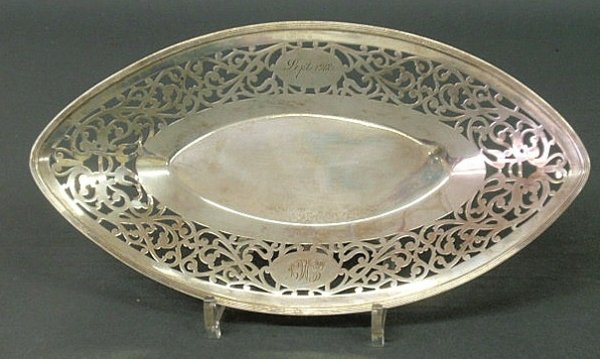 Sterling silver bread tray by Gorham, inscribed "S: Sterling silver bread tray by Gorham, inscribed "Sept.1912" and monogrammed. 13"l.