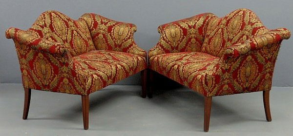 Pair of Chippendale style mahogany camelback sette: Pair of Chippendale style mahogany camelback settees, one is an original from the John DuPont Estate, the other is a copy of it. 34"h.x49"w.x28"d.