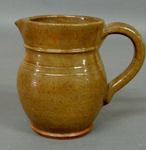 Redware pitcher with green glaze signed “Made in S: Redware pitcher with green glaze signed “Made in Stahl’s Pottery by Thomas Stahl April 25, 1938”. 6”h.