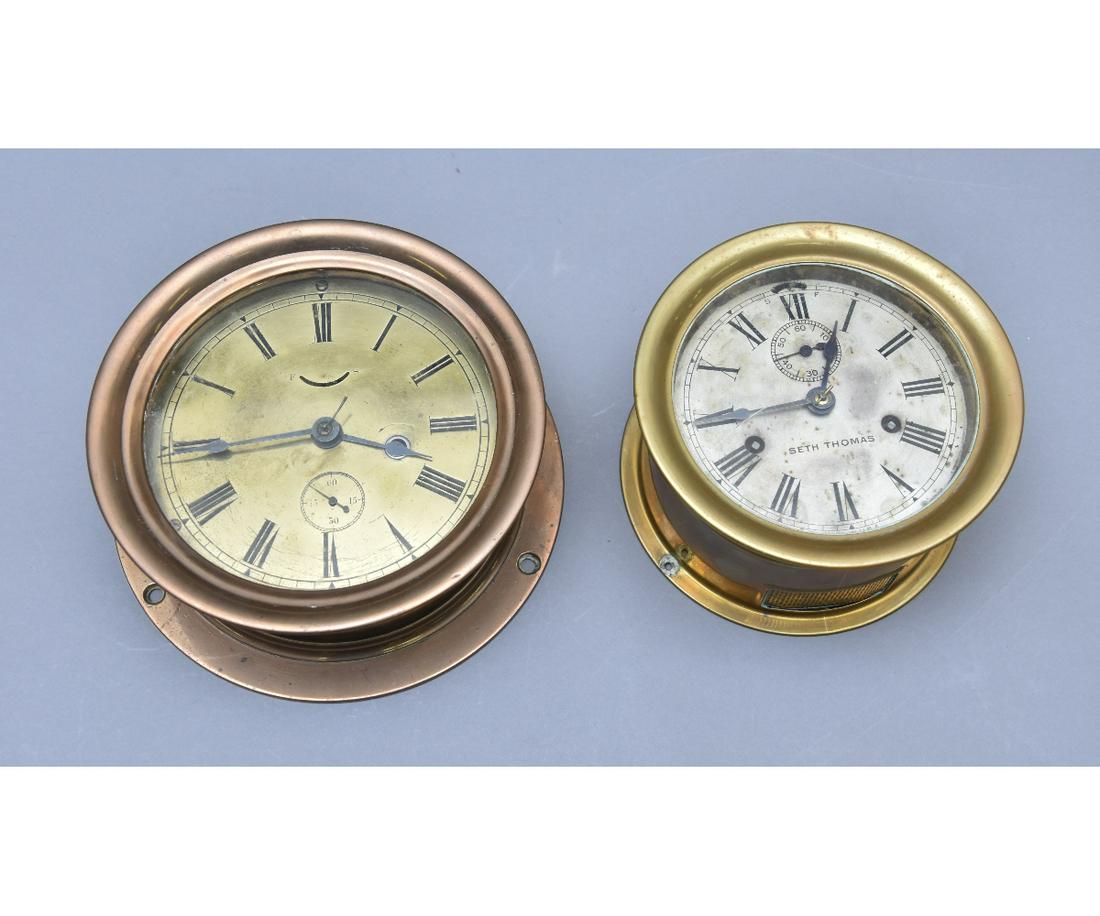 Seth Thomas Bronze Ship Clock etc.: Seth Thomas bronze ship clock 8.5"dia x 3.5"deep; together with a brass example with strike 7"dia x 4"deep
