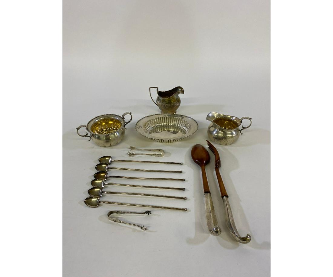 Sterling Silver Tableware: Sterling silver tableware to include creamer/sugar bowl, oval dish, ice tea spoons 8.25"l, sugar tongs, salad set with wood handles and an English creamer 16 total troy oz. excluding the salad set