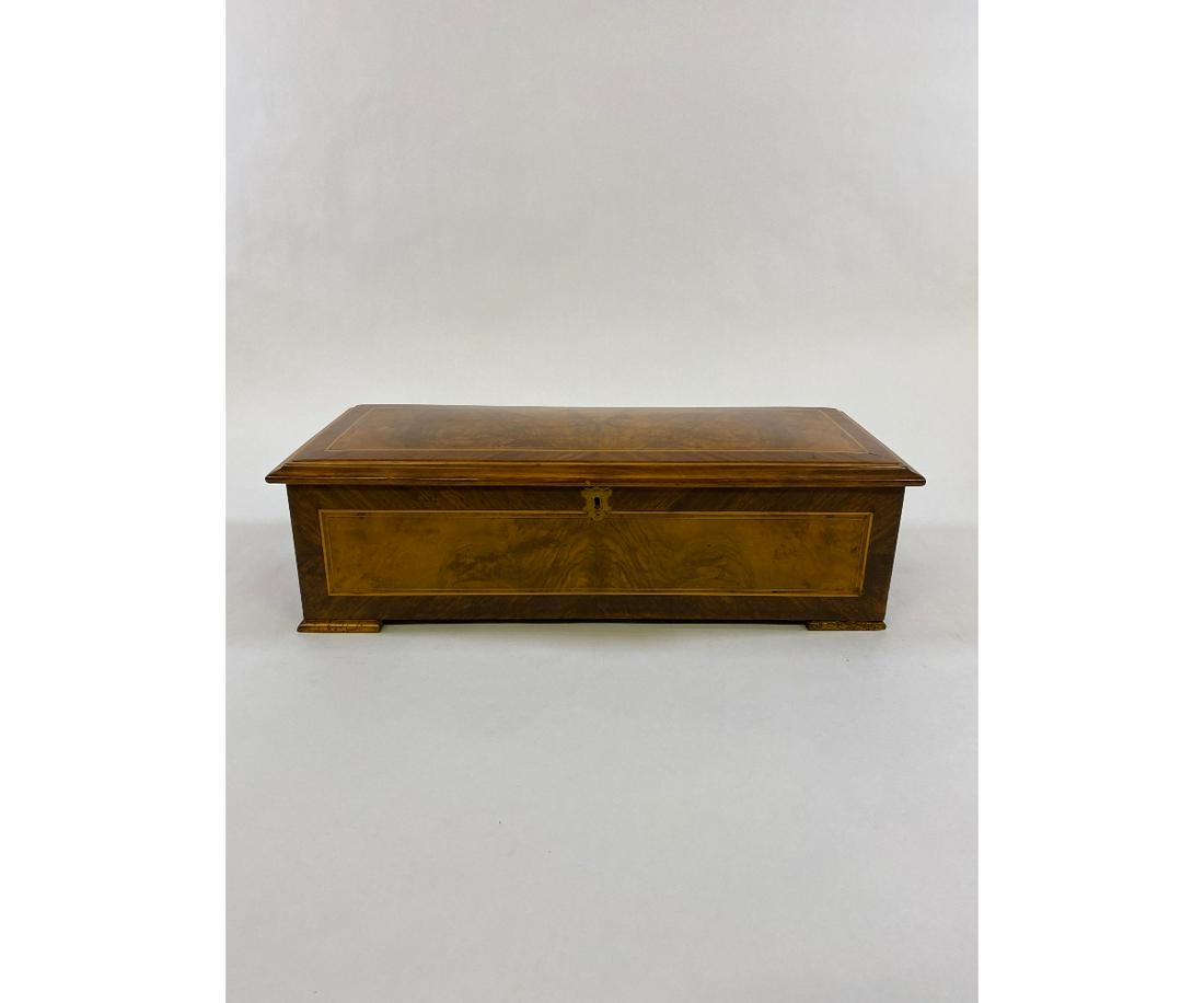 Mahogany Cased Swiss Music Box: Mahogany cased cylinder roll, ten-tune Swiss music box, circa 1890 with 10.75"l comb 7"h x 23.5"l x 10"d