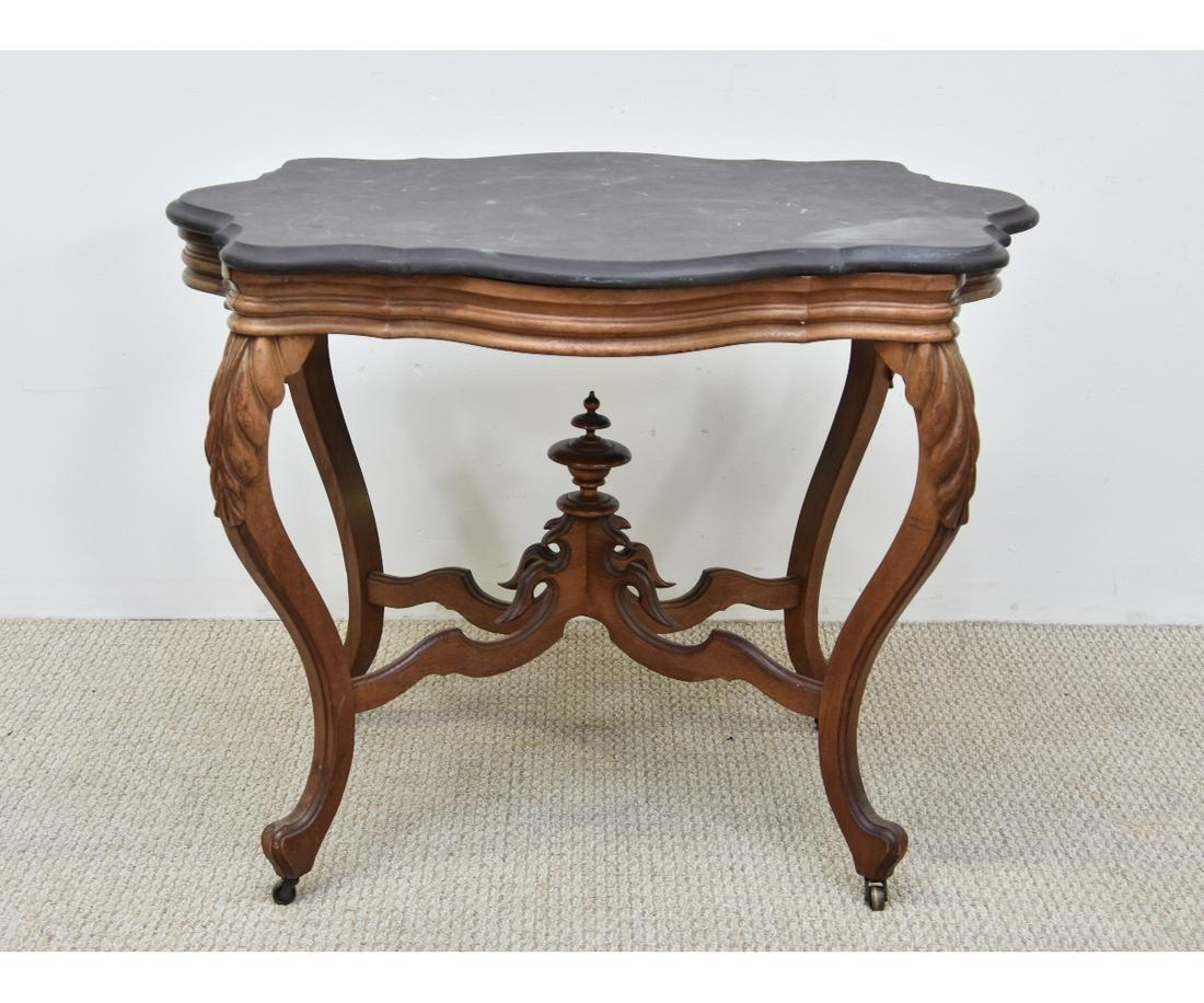 Victorian Carved Walnut Table: Victorian carved walnut table with shaped slate top 28.75"h x 37"w x 28"d