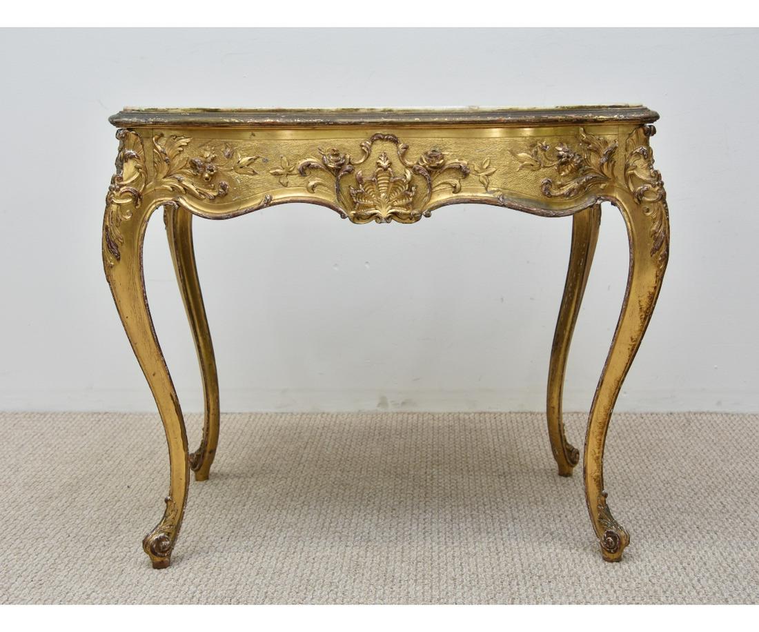 French Marble Top Louis XVI Style Table: French marble top Louis XVI style, carved and gilt decorated table, probably 19th c. 30.25"h x 38"w x 25"d