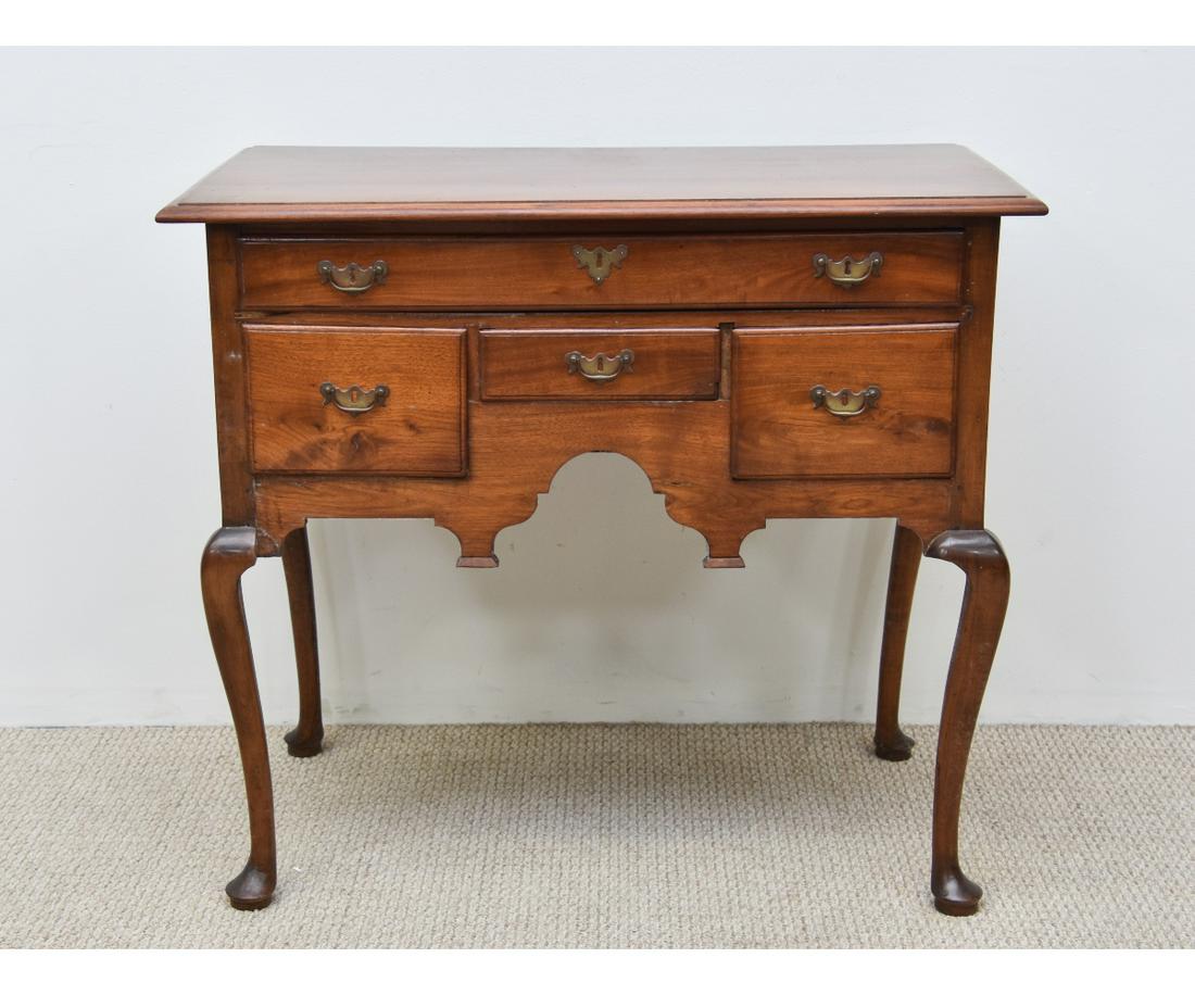 Walnut Queen Anne Highboy Base: Walnut Queen Anne highboy base, 18th c. New England, with molded top over one long and three narrow lipped drawers, scalloped apron all on cabriole legs and padded feet, original brasses 35.25"h x 39.