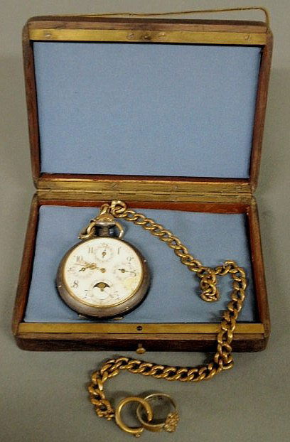 Victorian pocket watch with a moon dial and gold f: Victorian pocket watch with a moon dial and gold filled watch chain with a fitted mahogany box. 2"dia.