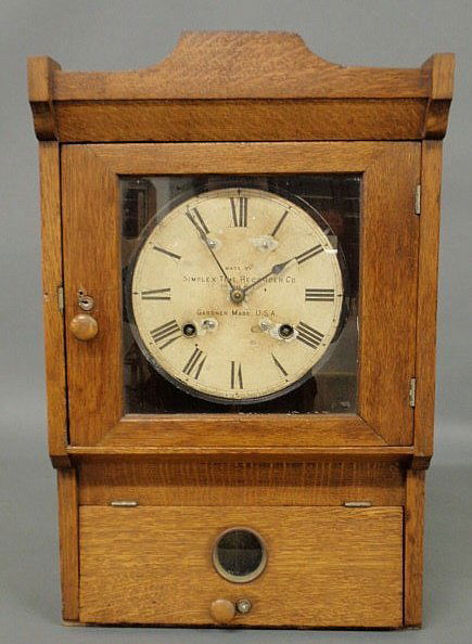 Oak cased clock “Made by Simplex Time Recorder Co.: Oak cased clock “Made by Simplex Time Recorder Co., Gardner, Mass., U.S.A.” 23”h.x14.5”w.x5.5”d.