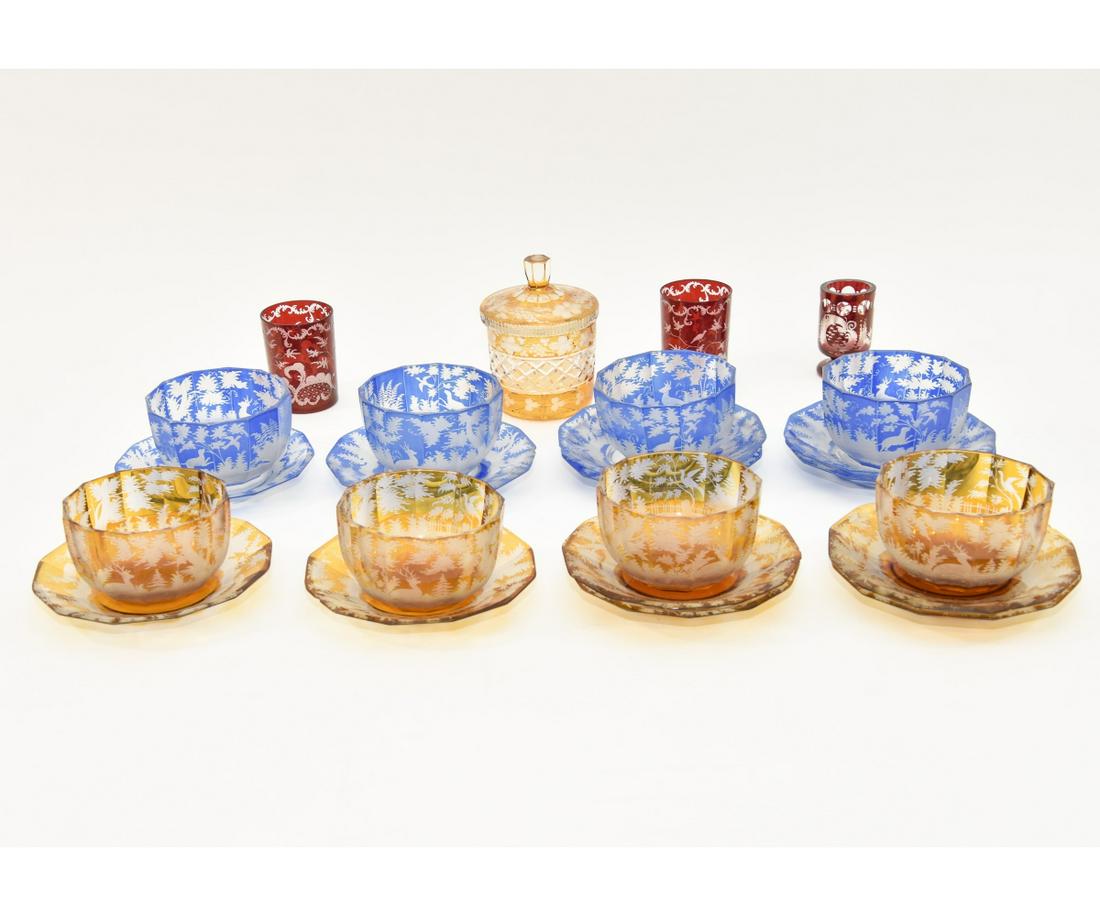 Bohemia Glass Etched Finger Bowls: Bohemia glass etched finger bowls; 4 amber bowls and 6 saucers (all with rim chips); 4 blue bowls (losses to paint) and 6 saucers (5 with rim chips and paint loss); bowls are 3"h x 4.75"dia, plates 6.