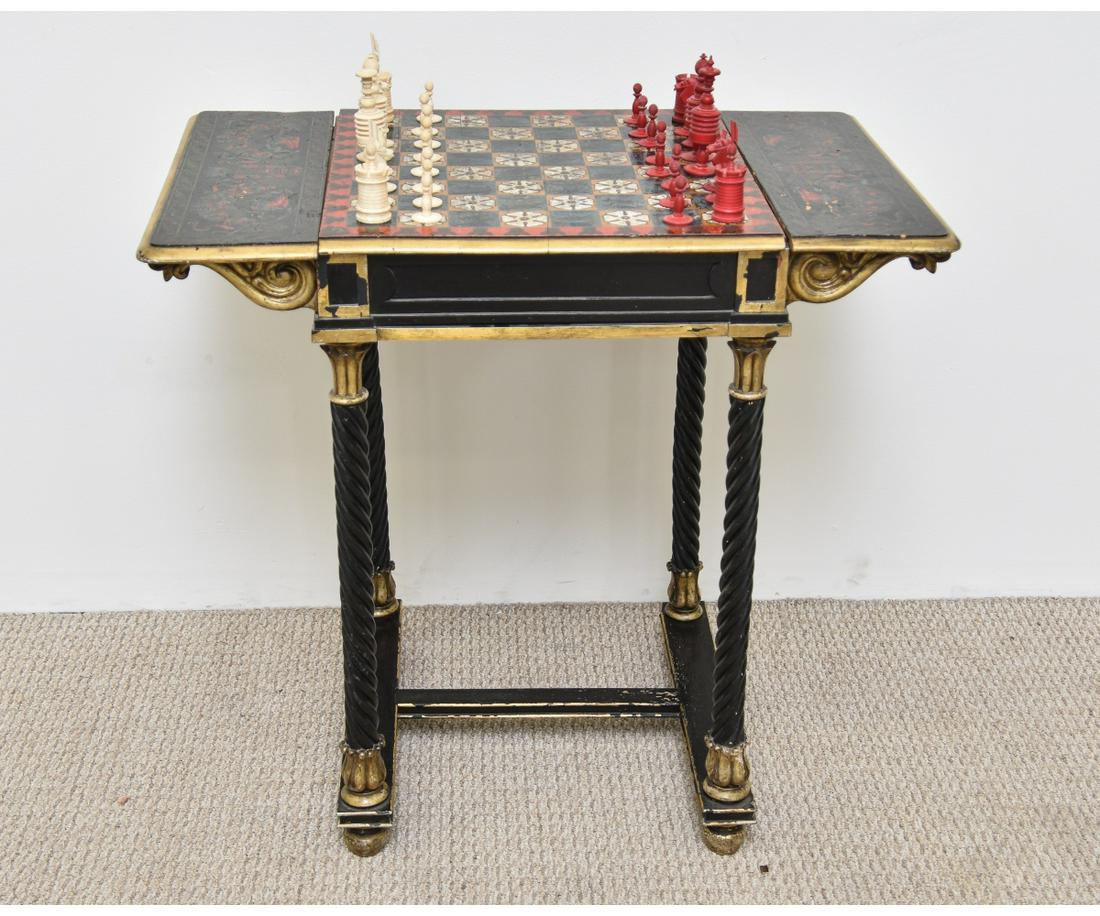 Ornate Continental Chess Board: Ornate Continental chess board with painted rams heads, birds and flowers, late 19th c., center slides open to hold the chess pieces, with French bone-carved chess men, largest 5"h. Chess board 29"h x