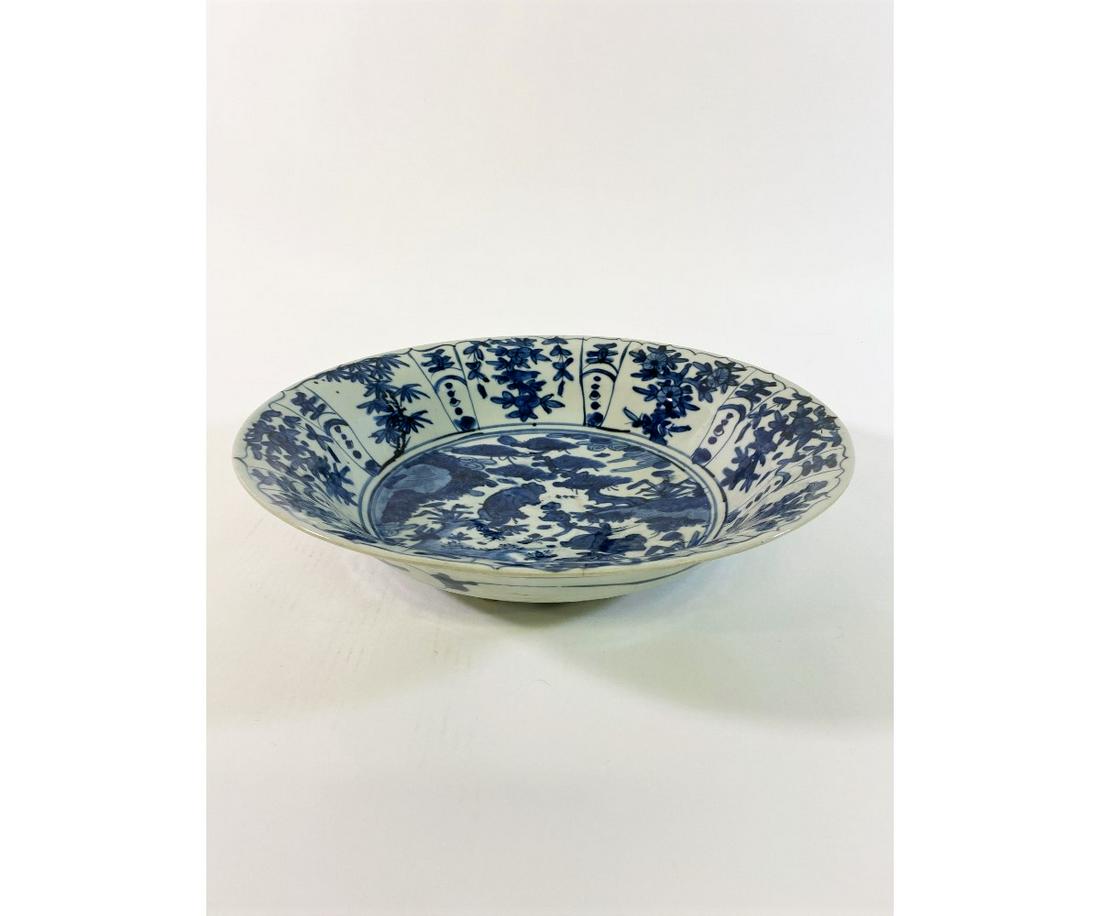 Chinese Blue and White Bowl: Chinese blue and white deep bowl, 18th c. possibly Swatow, decorated with central garden scene with paneled flower border. 3.5"h x 15.25"dia