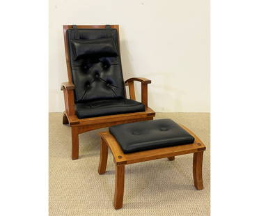 Thomas Moser Cherry Lolling Chair & Ottoman: Thomas Moser (Maine) cherry adjustable lolling chair and ottoman in black leather, each piece signed and dated. Chair 40"h x 28.25"w x 24.5d / 13.5" seat height Ottoman 15.5"h x 24"w x 17.5"d