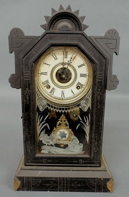 Ebonized wood mantel clock with Wm. L. Gilbert Co.: Ebonized wood mantel clock with Wm. L. Gilbert Co., Winsted, Conn. label, alarm and etched glass door. 19"h.x10.75"w.