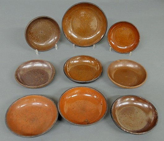 Nine 19th c. Pennsylvania redware pie plates, larg: Nine 19th c. Pennsylvania redware pie plates, largest 8.75"dia.