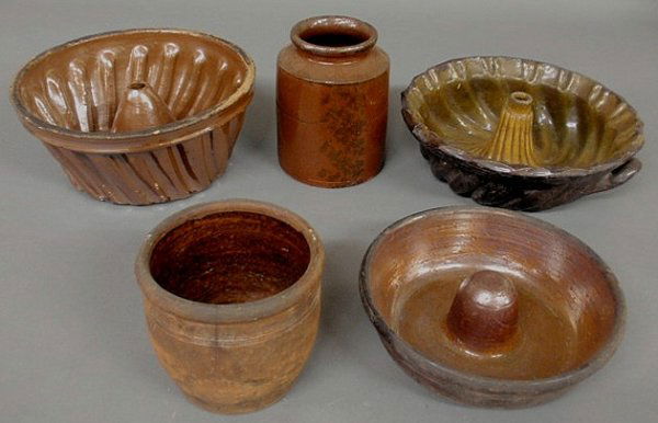 Three 19th c. Pennsylvania redware Turk's Head mol: Three 19th c. Pennsylvania redware Turk's Head molds, largest 4.5"h.x9.5"dia., and two jars.