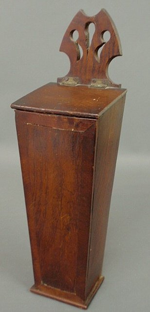 Walnut hanging candle box, 19th c., with a carved: Walnut hanging candle box, 19th c., with a carved pierced top. 15"h.