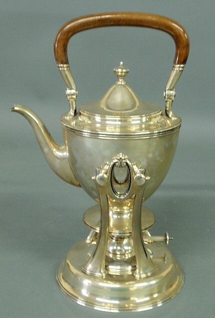 Tiffany & Co. sterling silver hot water kettle on: Tiffany & Co. sterling silver hot water kettle on stand with a mahogany swing handle, 2.25 pint, 13"h. to top of handle