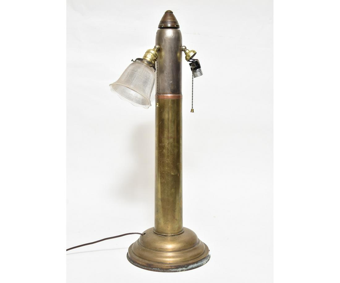 Large Brass Artillery Shell Lamp: Large brass artillery shell converted to an electric lamp. 27"h overall Base 3"h x 9.5"dia