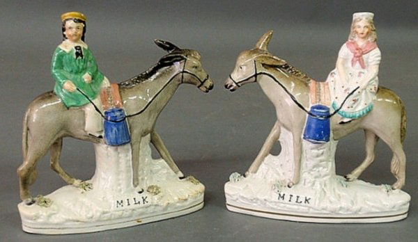 Pair of Staffordshire figural groups of a boy and: Pair of Staffordshire figural groups of a boy and girl riding donkeys titled "Milk". 9"h.x7.5"w.