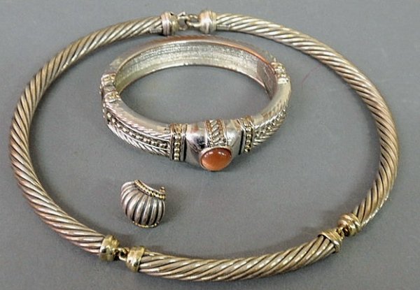David Yurman sterling silver (925) and 14k gold ch: David Yurman sterling silver (925) and 14k gold choker necklace, a single Lagos "Caviar" sterling silver (925) and 18k gold earring and a Yurman type cast metal bracelet.