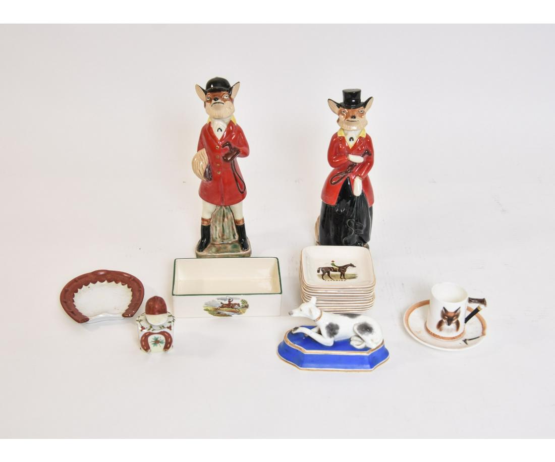 SNOOT-IE FOX DECANTERS etc.: Mr. & Mrs. Snoot-ie Fox ceramic decanters 11"h (losses to corks, chip to one ear); Sandland equine ash trays; Royal Daulton cup/saucer; Copeland box (no lid); and a jockey figure porcelain inkwell etc
