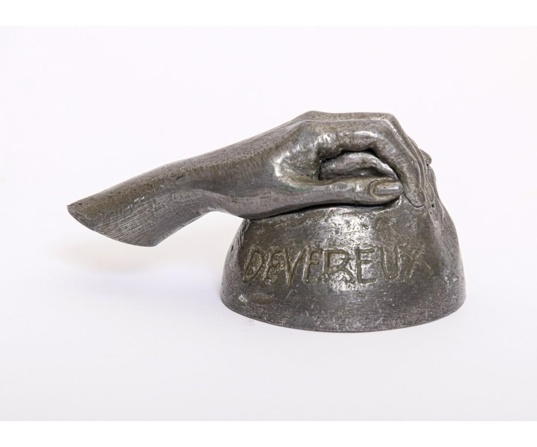 ROBERT GRAHAM LEAD SCULPTURE: Robert Graham lead metal sculpture of a hand, desk paperweight inscribed 'Devereux' and signed "R.G. 1982". 2.5"h x 5.5"w x 3"d