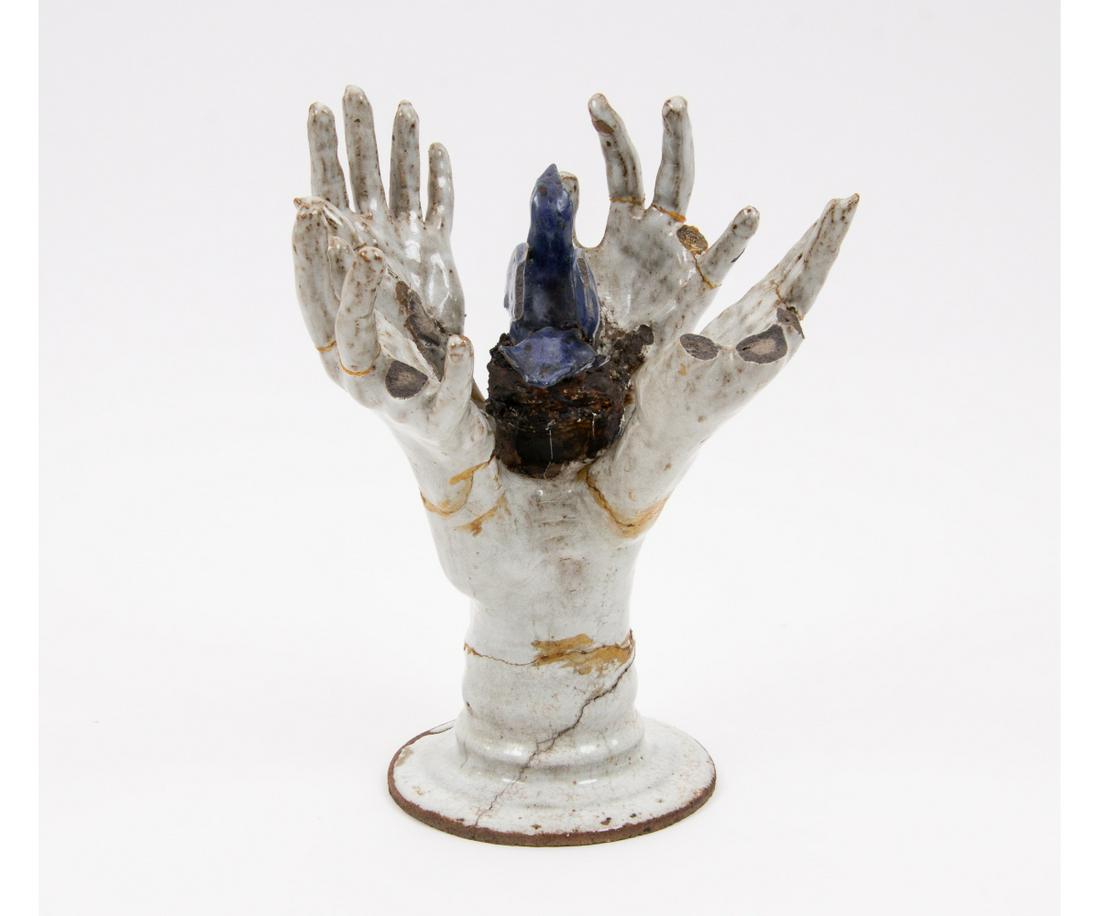PORCELAIN BLUE BIRD IN HANDS SCULPTURE (1 of 7)