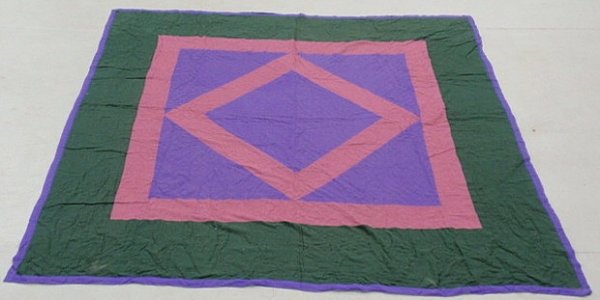 Amish quilt with geometric center pattern and a da: Amish quilt with a geometric center pattern and a dark green border. 82”x80”