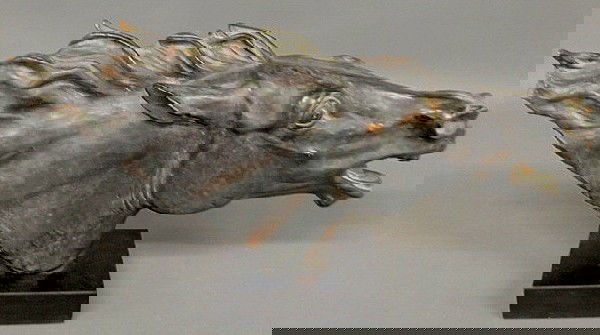 Terracotta horsehead with a faux bronze finish sig: Terracotta horsehead with a faux bronze finish signed "Austin Prod. 1967". Losses. 12"h.x26"l.