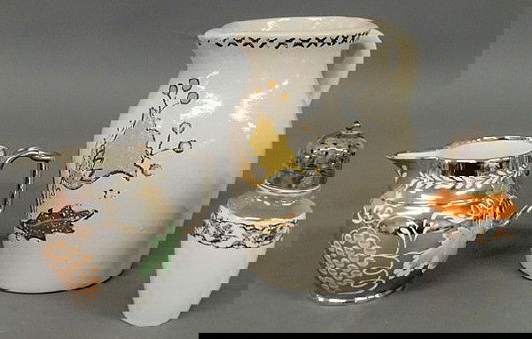 Earthenware pitcher, 19th c., with painted tulip.: Earthenware pitcher, 19th c., with painted tulip. 8.5"h., a silver luster pitcher and a ceramic caster with a silverplate top.