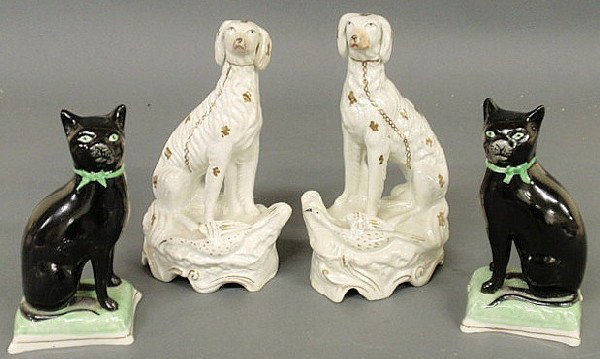 Pair of 19th c. Staffordshire seated game dogs 9"h: Pair of 19th c. Staffordshire seated game dogs 9"h. and a pair of black cats of a later date seated on green bases 7"h.