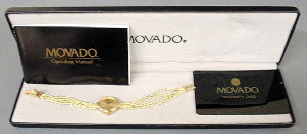 Ladies Movado wristwatch with a 14k gold case and: Ladies Movado wristwatch with a 14k gold case and four-strand rope twist chain band, 5.1 dwt.