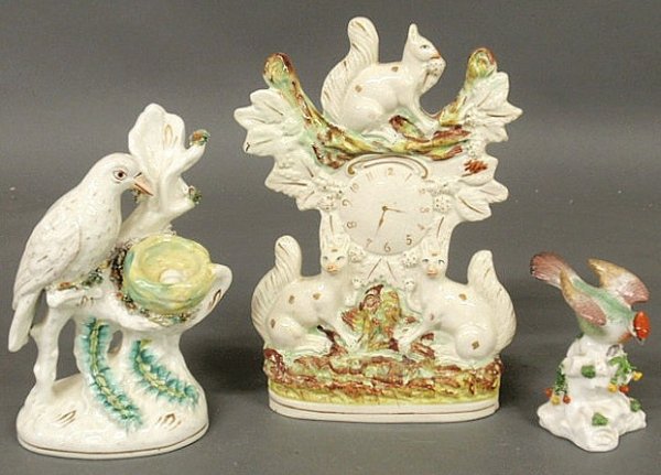 Three 19th c. Staffordshire figural groups, two wi: Three 19th c. Staffordshire figural groups, two with birds and one with squirrels and clock tower.