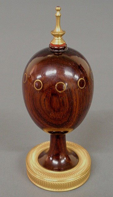Russian style faux wood decorated metal egg signed: Russian style faux wood decorated metal egg signed "T. Fabergé No. 492" with fire gilt base. 4.5"h.