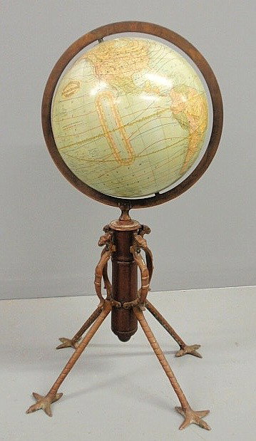 Rand McNally & Co. Victorian globe with a brass ri: Rand McNally & Co. Victorian globe with a brass ring and mahogany shaft, the legs with griffin heads and claw feet. 31"h.