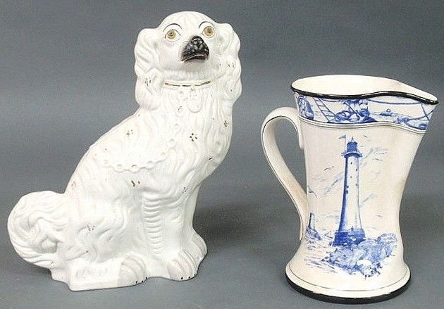 Staffordshire seated white spaniel 12.5"h., mid 19: Staffordshire seated white spaniel 12.5"h., mid 19th c., and a Buffalo Pottery Marine pitcher 9"h.