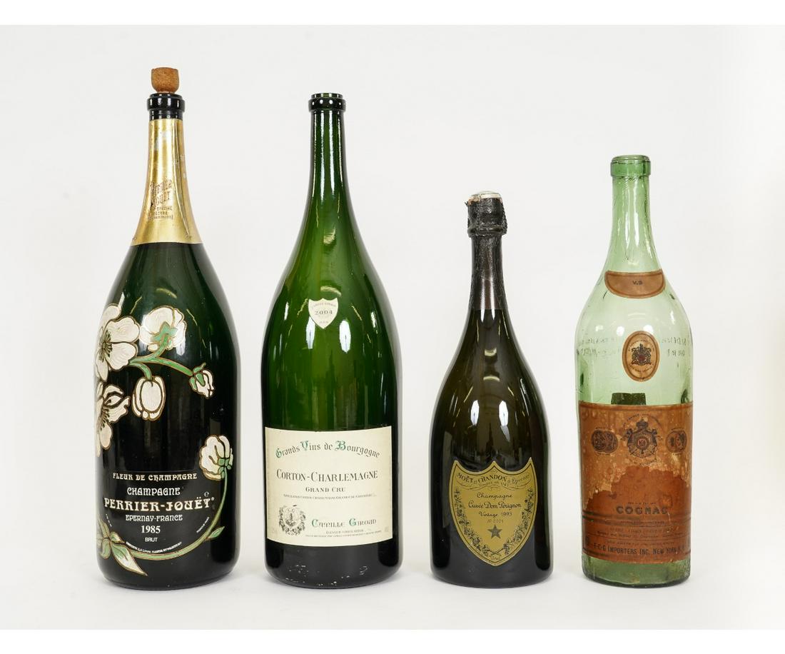 FOUR VINTAGE BAR TOP LIQUOR BOTTLES: Four vintage bar top liquor bottles including a large Perrier Champagne bottle. 23"h x 6"dia