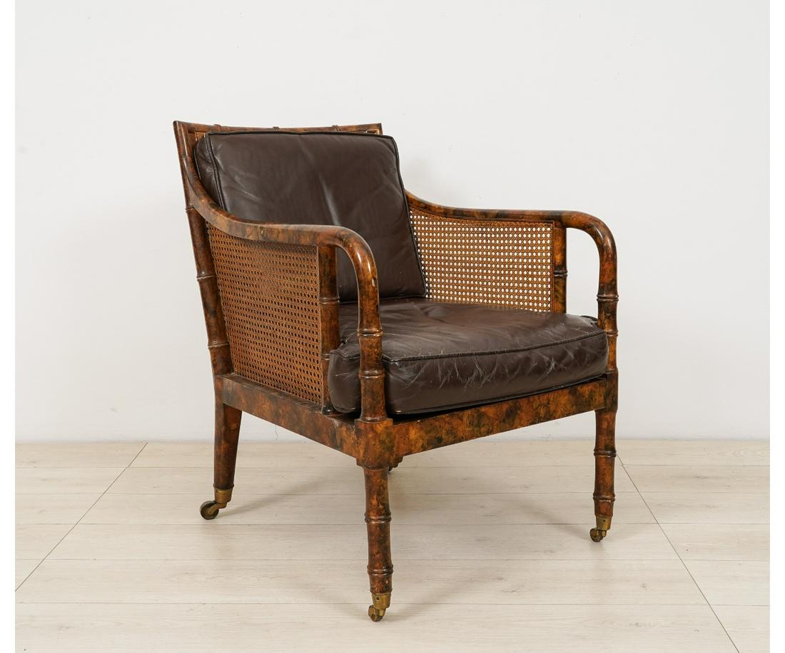 CANE AND BAMBOO STYLE ARMCHAIR: Cane and bamboo style armchair with leather cushion, probably 1960's. 32"h x 23.5"w x 24"d