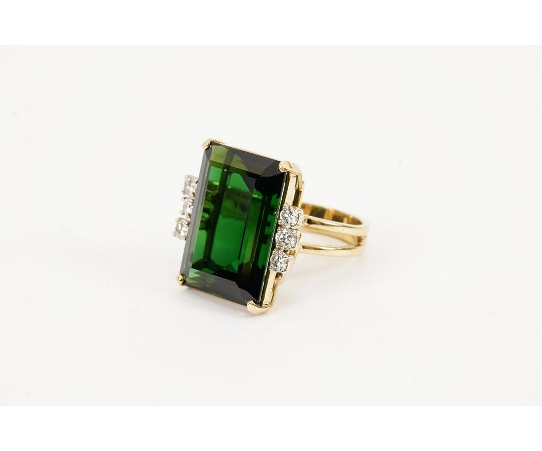 TOURMALINE AND DIAMOND RING: Ladies 18k gold cocktail ring with green tourmaline stone (15-20 carats) and 6 brilliant cut diamonds (.75 carats). Setting: .5"h x 1"w x 1"d 15.2 grams total weight / Size 8.25 Profile: 1.125"h