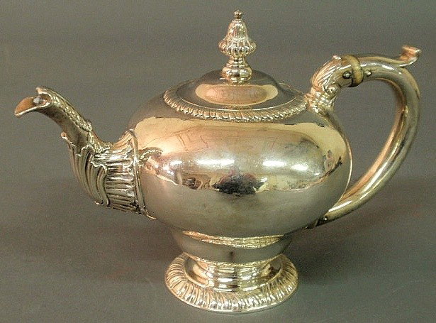 George II English silver teapot by Charles Wright: - George II English silver teapot by Charles Wright and Thomas Whipham, London 1759-1760, with an inverted pear shaped body, the spout and handle with scroll and shell motifs and gadrooned finial and 